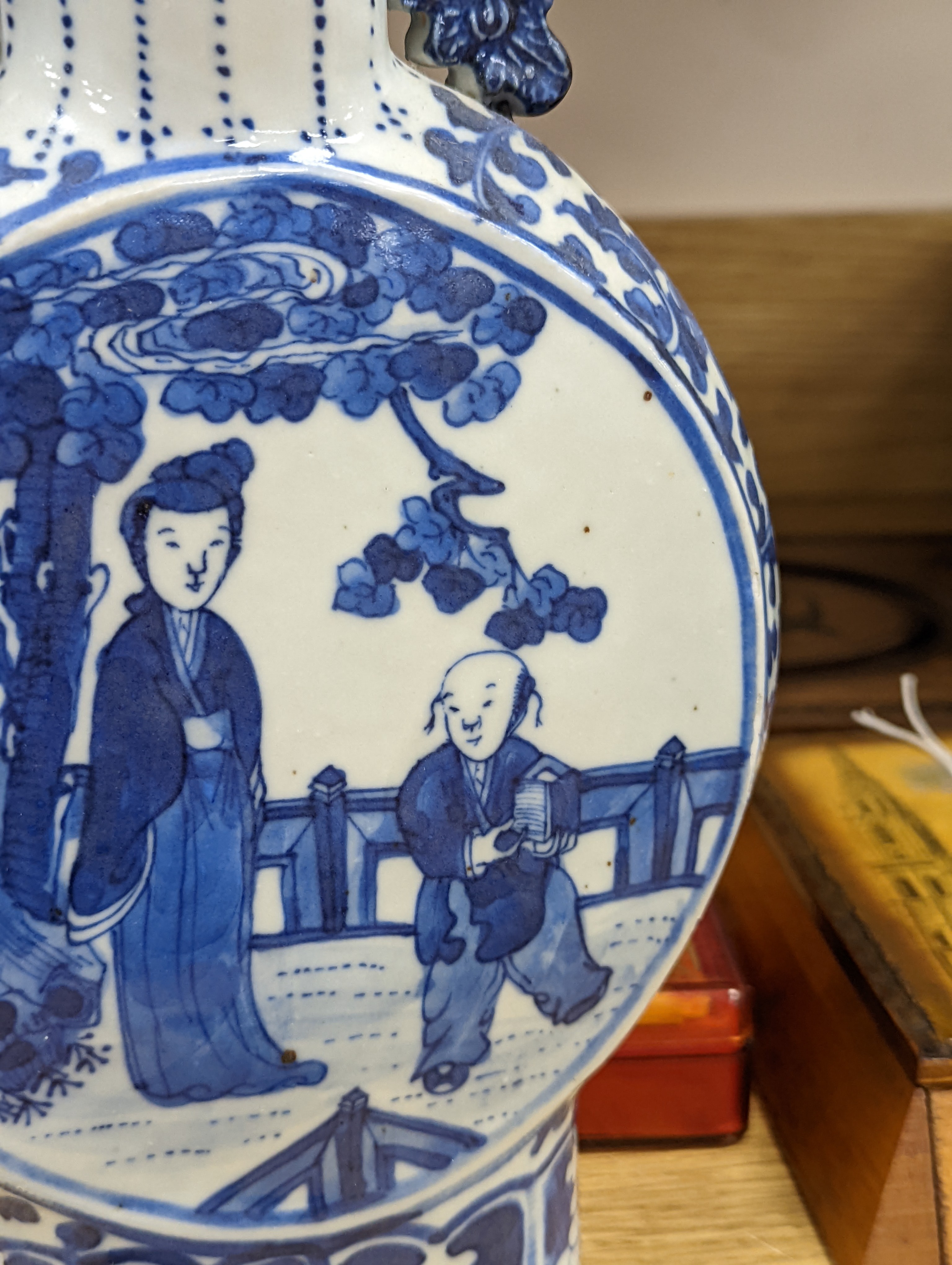 Three 19th century Chinese blue and white Moon flasks, tallest 31 cms.